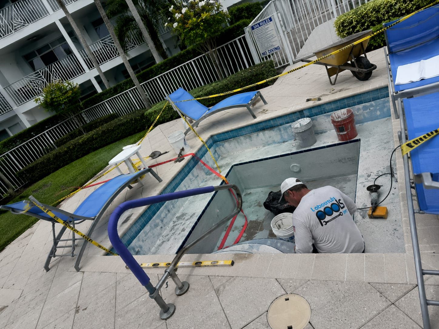 Labounty Pools technician resurfacing a spa on-site